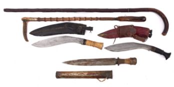 A bone handled Kukri, together with one other , also a Far Eastern dagger in plated scabbard,