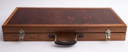 A cased Selector Compound archery bow,