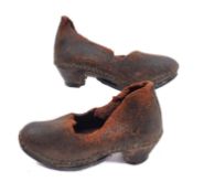 A pair of late 19th/early 20th century Child's brown leather clogs,