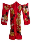 A Japanese mans' kimono, in red with gold and silver floral embroidery.