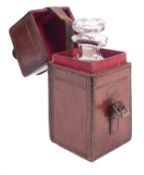 An early 20th century leather cased travelling decanter,