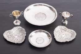 Two silver coin dishes,
