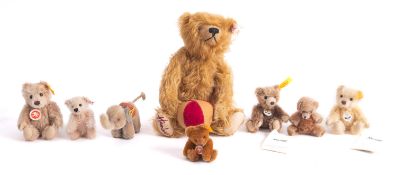 A group of Steiff bears, including a Hamley's blonde bear holding a stripped ball 24cm high,