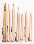 Eversharp and other makers. A group of seven gold plated propelling pencils.