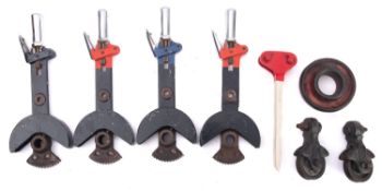 Four short signal levers, together with one other lever, two GWR pulleys and a ring.
