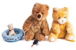 Two Steiff bears, 'Molly' cat 33cm high, a brown bear, together with a Steiff pet bed,