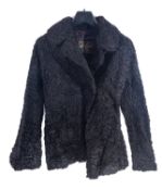 A Royal Naval Cape by Gieves Ltd,