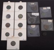Thirteen Roman bronze coins.