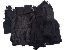 A collection of various mid to late 20th century textiles including sections of black lace,