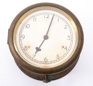 A brass bulkhead clock, unsigned, the 5 1/2 inch dial with Arabic numerals and steel hands,