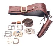 A brown leather Western style gun belt with holster, unsigned with six inert Colt .