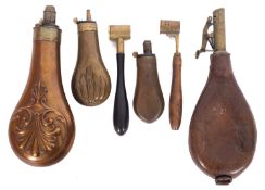 Two 19th century copper pistol powder flasks, unsinged, together with a larger copper powder flask,