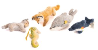 A group of five Steiff animals, including a dolphin 'Clippy' a seahorse 'Swimmy', with two foxes,