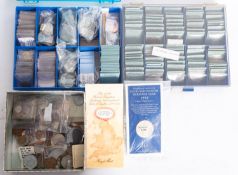 A collection of World coins in packages.