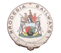 Rhodesia railways. A hand painted iron carriage crest, 41.5cm diameter.