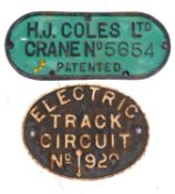 A BR oval 'Electric Track Circuit No. 920' cast iron sign, 29cm wide, together with an 'H.
