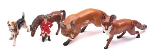 A Beswick model of a fox together with a Sylvac model of a fox ,