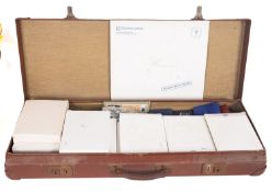 A case containing boxed Royal Mint proof sets,