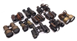 A collection of various binoculars and field glasses, various makers including Goerz,