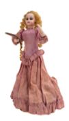 A late 19th century Jumeau automaton doll, the bisque head with applied blonde wig,