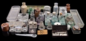 A collection of various glass and other ink wells and bottles, etc.