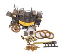 A scratch built wooden model of the Stroud- London mail coach, in back and yellow,