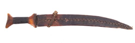 A Middle Eastern horn handled short sword,