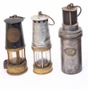 Three miner's lamps.