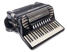 An Excelsior Model 304 piano accordion, black and silver in case.