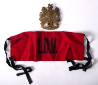 A Yorkshire Artillery helmet plate, together with an 'LDV' armband.