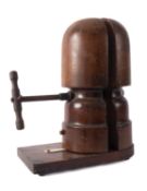 A late 19th /early 20th century milliner's hat stretcher, unsigned, 37cm high.