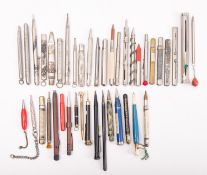 A group of various propelling pencils and pencil holders,