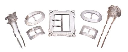 A mixed group of silver including; two hair pins, a pair of rectangular shoe buckles,