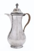 A George III hot water jug by Francis Crump, London 1759, of pear shape,