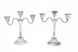 A pair of Elizabeth II silver twin branch candelabra by Barrowclift Silvercraft, Sheffield 1973,