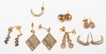 A small group of earrings, including three pairs of drop earrings,
