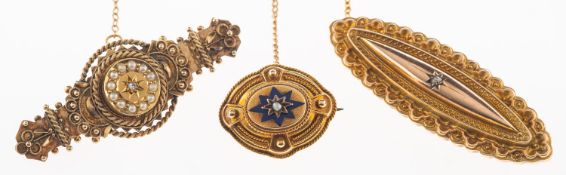Three Victorian brooches, including a Victorian navette shaped mourning brooch,