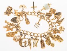 A curb link charm bracelet with charms, the bracelet with heart padlock and safety chain,