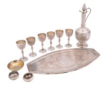 A mid 20th century Iranian export silver liqueur set, unmarked, comprising an oval tray,