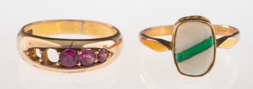 Two gemstone set rings, including a ring set with five circular-cut pink stones,