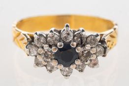 An 18ct gold sapphire and diamond cluster ring,