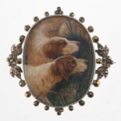 A hand painted dog brooch, a white metal brooch with two hand painted pointer dogs,