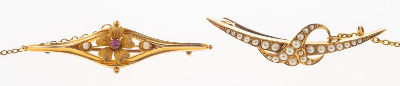 Two antique brooches, including an openwork bar brooch with a central flowerhead,