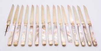 A set of fifteen French Empire silver gilt dessert knives .950 Paris 1809-19, maker's mark J.