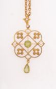 An antique peridot and seed pearl pendant with chain,