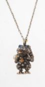 A diamond, sapphire, pearl and enamel 'creature' pendant with chain,