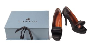Lanvin. A pair of black satin River 2009 platform pumps, with satin scroll to toe, size 38.