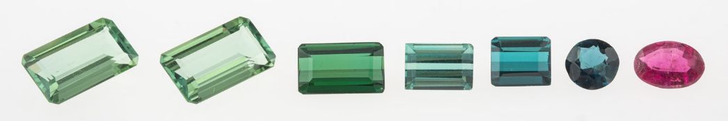 A group of seven loose semi-precious gemstones: A loose emerald-cut green tourmaline, approx. 1.