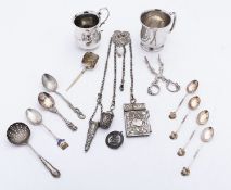 A mixed group of silver including; a pair of cast Victorian tea tongs maker's mark poorly struck,