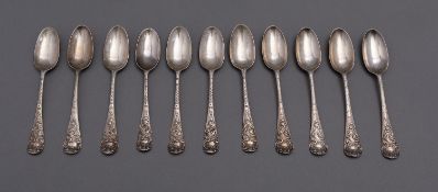 A set of eleven Shell back teaspoons, marks distorted, late 19th century,